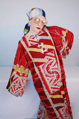 Women's vintage 1970's long sleeve printed cotton muu muu dress in red, green, grey, and white.