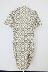 short sleeve green and cream printed knee length dress with front zipper and tie belt vintage 1970's