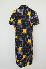short sleeve knee length black printed polyester shirt dress with collar vintage 1970's