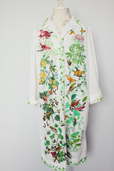 long sleeve mid length shirt dress in white with all over bird print polyester women's vintage 1960's