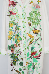 long sleeve mid length shirt dress in white with all over bird print polyester women's vintage 1960's
