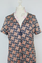 black and brown abstract print short sleeve mid length zip up dress vintage 1960's