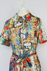 all over floral print short sleeve knee length dress with front half zipper and matching tie belt vintage 1970's