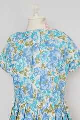 short sleeve blue floral print midi length dress with a line structure women's vintage 1960's