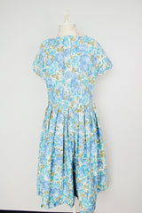 short sleeve blue floral print midi length dress with a line structure women's vintage 1960's