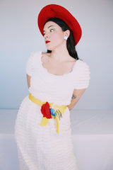 Women's vintage 1970's short sleeve maxi length white dress with tiered lace ruffles all over and an attached yellow belt with flowers