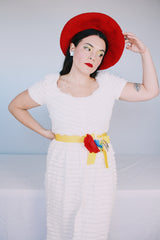 Women's vintage 1970's short sleeve maxi length white dress with tiered lace ruffles all over and an attached yellow belt with flowers