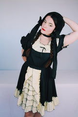 Women's vintage 1970's SaSabobs label two piece top and skirt set square dance costume in black and white.