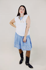 sleeveless white sweater vest with v neck with crest on left chest vintage 1970's