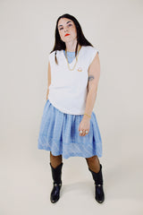 sleeveless white sweater vest with v neck with crest on left chest vintage 1970's