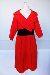 Women's vintage 1950's Jr. Plenty Shop, Lane Bryant label 3/4 arm length midi length red dress with V shaped neckline, black velvet waistband and double lapel collar.