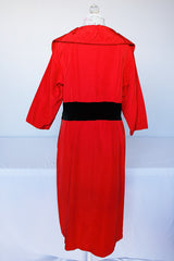 Women's vintage 1950's Jr. Plenty Shop, Lane Bryant label 3/4 arm length midi length red dress with V shaped neckline, black velvet waistband and double lapel collar.