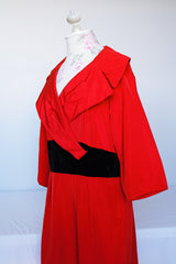 Women's vintage 1950's Jr. Plenty Shop, Lane Bryant label 3/4 arm length midi length red dress with V shaped neckline, black velvet waistband and double lapel collar.
