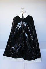 Women's vintage 1960's Aqua-Sheen by Exylin Co., Made in USA label vinyl material poncho with shiny exterior in black and white.