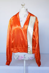 Women's or men's vintage 1940's/1950's long sleeve equestrian racing top in orange satin with one cream vertical stripe.
