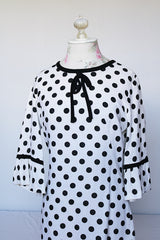 Women's vintage 1960's Gallant California short sleeve white linen dress with black polka dots all over. Has black bow tie on neck.