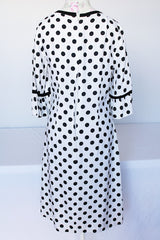 Women's vintage 1960's Gallant California short sleeve white linen dress with black polka dots all over. Has black bow tie on neck.