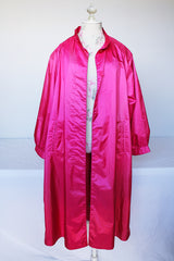 Women's vintage 1980's Windsor Bay long sleeve long length bright pink nylon and polyester button up windbreaker jacket.
