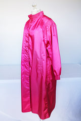 Women's vintage 1980's Windsor Bay long sleeve long length bright pink nylon and polyester button up windbreaker jacket.
