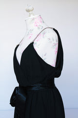 Women's vintage 1980's Morton Myles LTD., Union Made, Made in USA sleeveless rhinestone strap black midi length dress with V shaped neckline and ribbon tie belt.