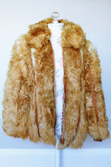 Women's vintage 1970's Designer Originals, Dino Ricco label long sleeve zip up tan brown faux fur jacket with rounded collar and side pockets.