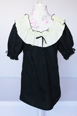 Women's vintage 1970's SaSabobs label two piece top and skirt set square dance costume in black and white.