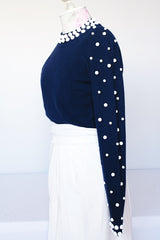 Women's vintage 1960's long sleeve midi length twofer dress with a navy cashmere top half and white polyester skirt. White beads all over top part.