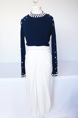 Women's vintage 1960's long sleeve midi length twofer dress with a navy cashmere top half and white polyester skirt. White beads all over top part.