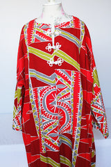 Women's vintage 1970's long sleeve printed cotton muu muu dress in red, green, grey, and white.