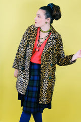 Women's vintage 1970's long sleeve long leopard print double breasted coat in velvet material.
