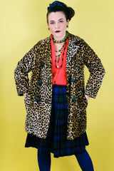 Women's vintage 1970's long sleeve long leopard print double breasted coat in velvet material.