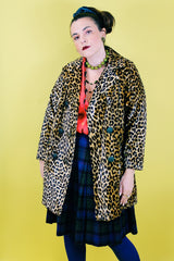 Women's vintage 1970's long sleeve long leopard print double breasted coat in velvet material.