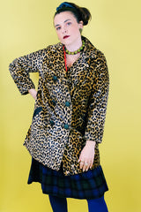 Women's vintage 1970's long sleeve long leopard print double breasted coat in velvet material.