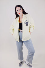 long sleeve light yellow zip up sport jacket with crest on left chest vintage 1970's