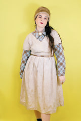 Women's vintage 1960's short sleeve midi length shift dress in oyster off white color