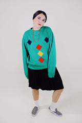 long sleeve kelly green pullover sweater with navy, yellow, and red diamond pattern vintage 1980's