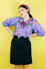 Women's vintage 1970's That's It! California label 3/4 arm length purple sheer lightweight polyester material pullover blouse in purple with all over floral print.