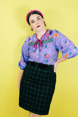 Women's vintage 1970's That's It! California label 3/4 arm length purple sheer lightweight polyester material pullover blouse in purple with all over floral print.