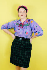 Women's vintage 1970's That's It! California label 3/4 arm length purple sheer lightweight polyester material pullover blouse in purple with all over floral print.