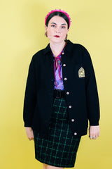 Women's vintage 1960's Dorce label long sleeve black wool button up cardigan with yellow patch with words La Costa on left chest.