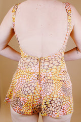 sleeveless one piece bathing suit in pink orange and yellow paisley print with skirt over bottom vintage 1970's