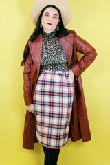 Women's vintage 1970's Weathervane label knee length pencil skirt in wool material, fully lined, cream color with red, navy, and blue plaid print.