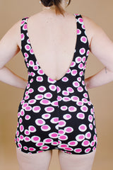 vintage 1960's one piece swimsuit in black with white and pink polka dots skirt in front over bottoms