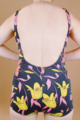 sleeveless one piece swimsuit black with floral print skirt in front vintage 1960's
