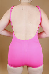 hot pink vintage 1960's one piece swimsuit with adjustable straps and skirt in front