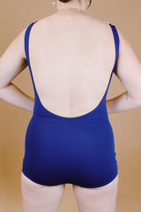 navy and cream two tone vintage 1960's one piece bathing suit with floral detail and skirt in front