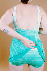 green and white printed one piece vintage 1960's swimsuit with full skirt