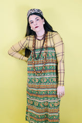 Women 's vintage 1970's cotton lightweight ankle length maxi skirt in all over green and brown abstract print.