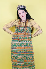 Women 's vintage 1970's cotton lightweight ankle length maxi skirt in all over green and brown abstract print.