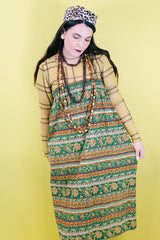 Women 's vintage 1970's cotton lightweight ankle length maxi skirt in all over green and brown abstract print.